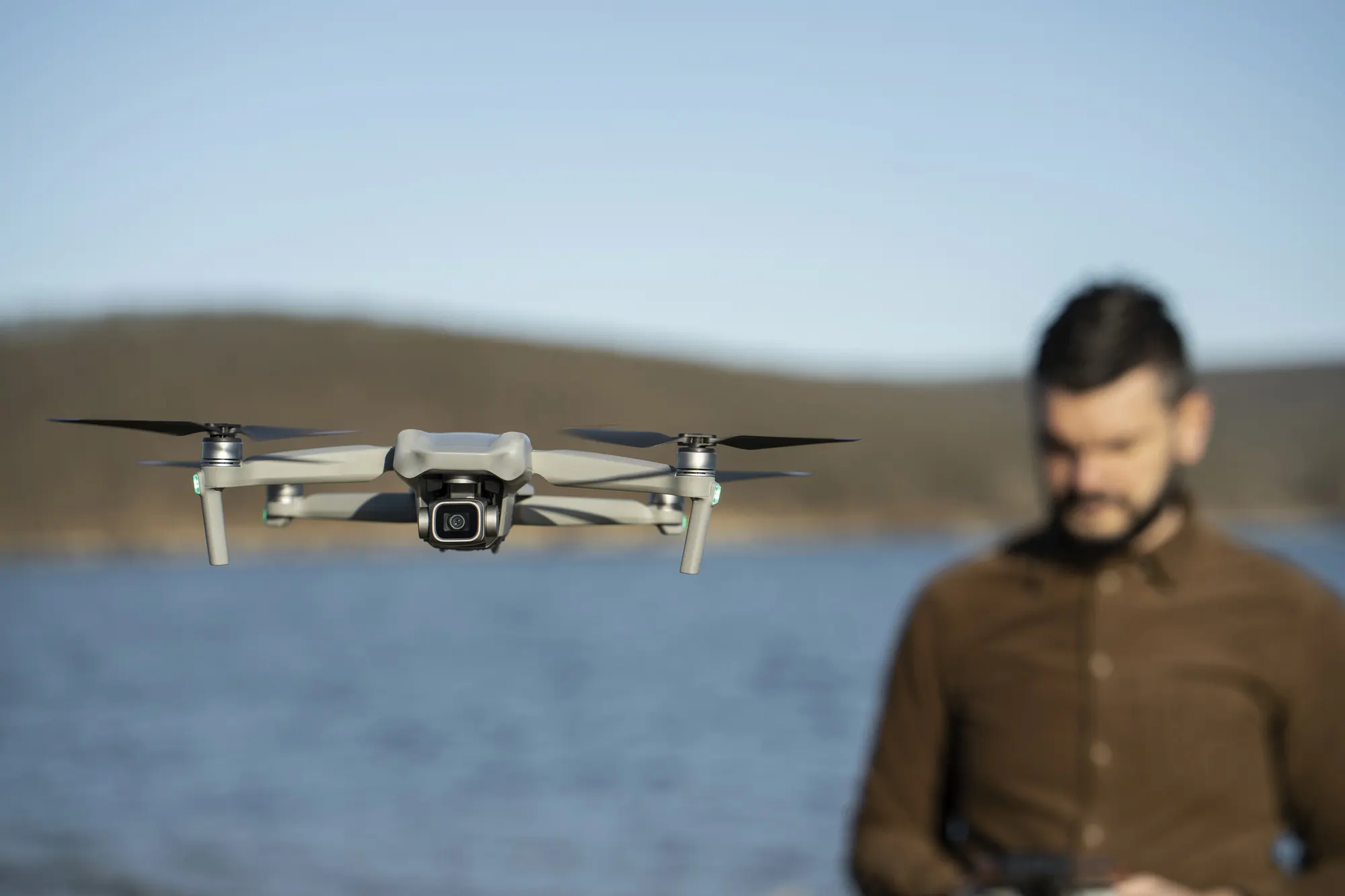 medium shot blurry man with drone outdoors 23 2149392704 1